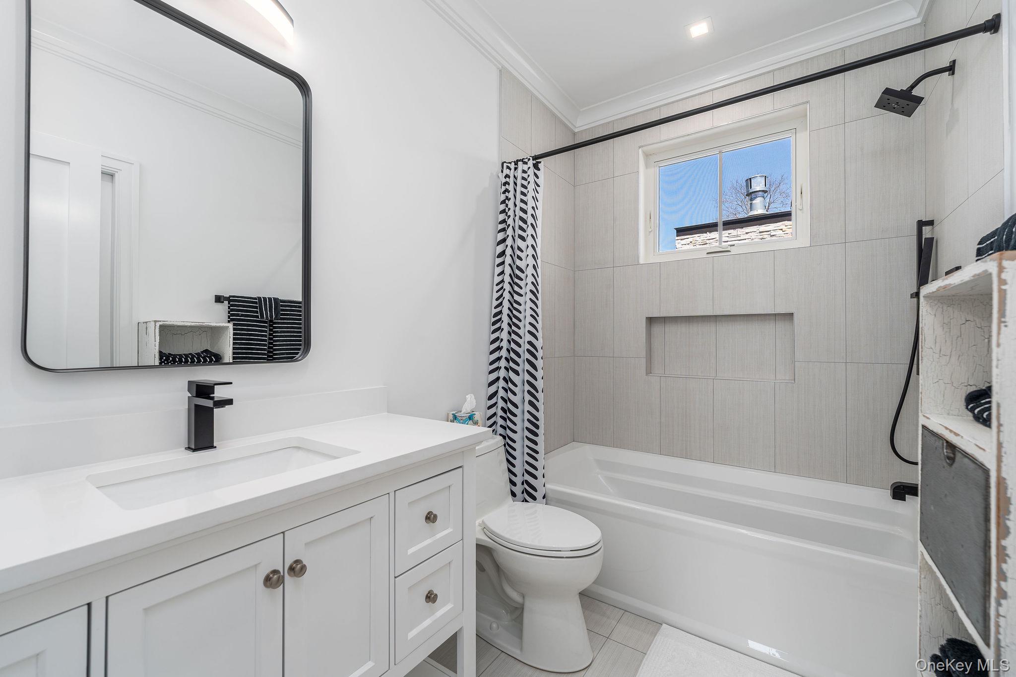 1665 Glenn Road Southold, NY 11971 - Photo 30 of 46 a bathroom with a sink a toilet and shower