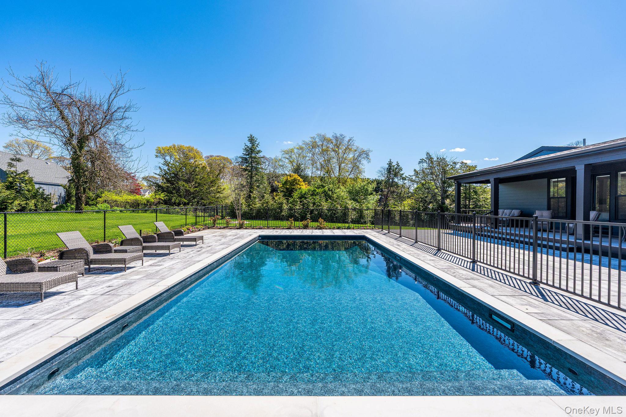 1665 Glenn Road Southold, NY 11971 - Photo 38 of 46 a view of a swimming pool with a lounge chair