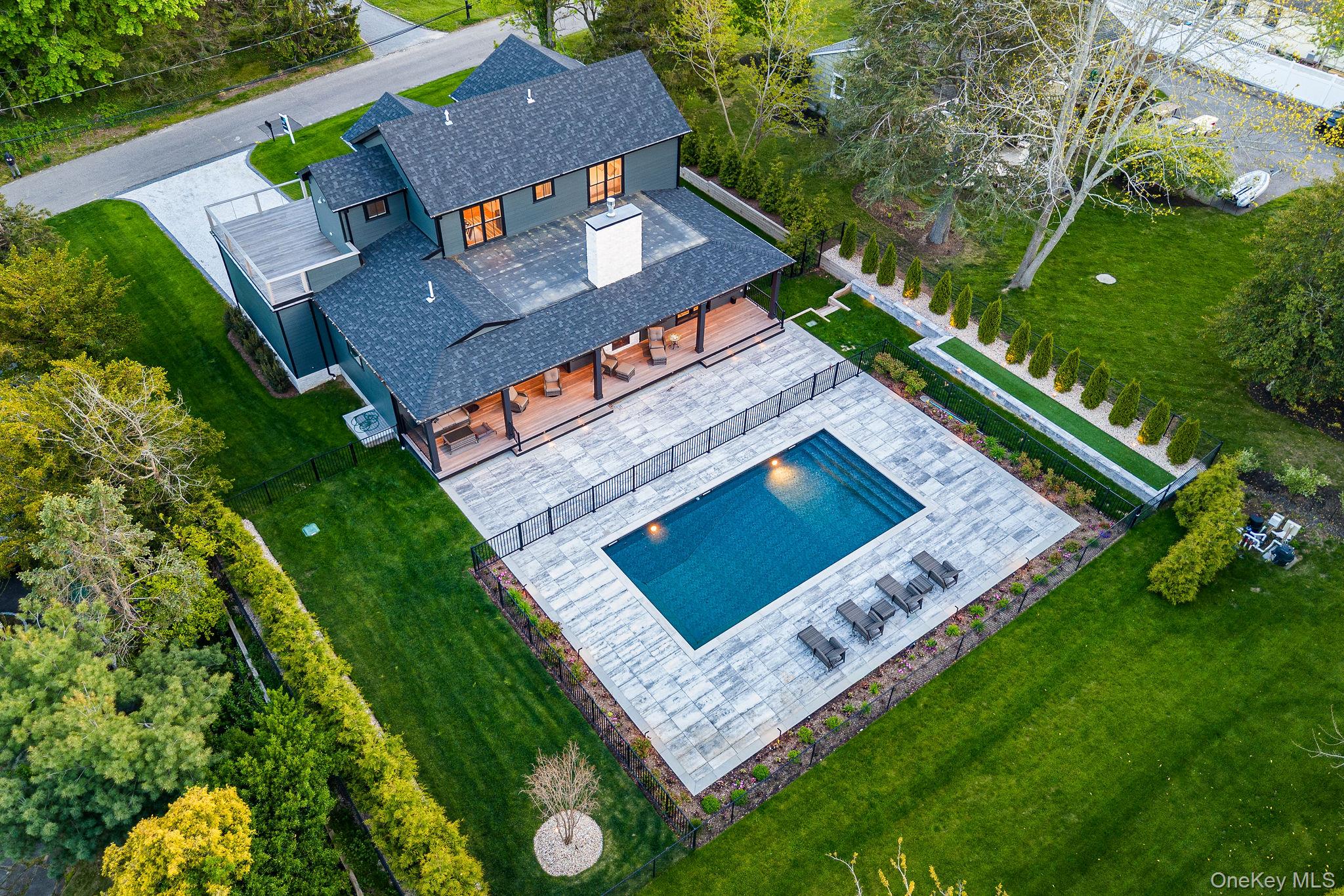 1665 Glenn Road Southold, NY 11971 - Photo 44 of 46 an aerial view of a house with a garden