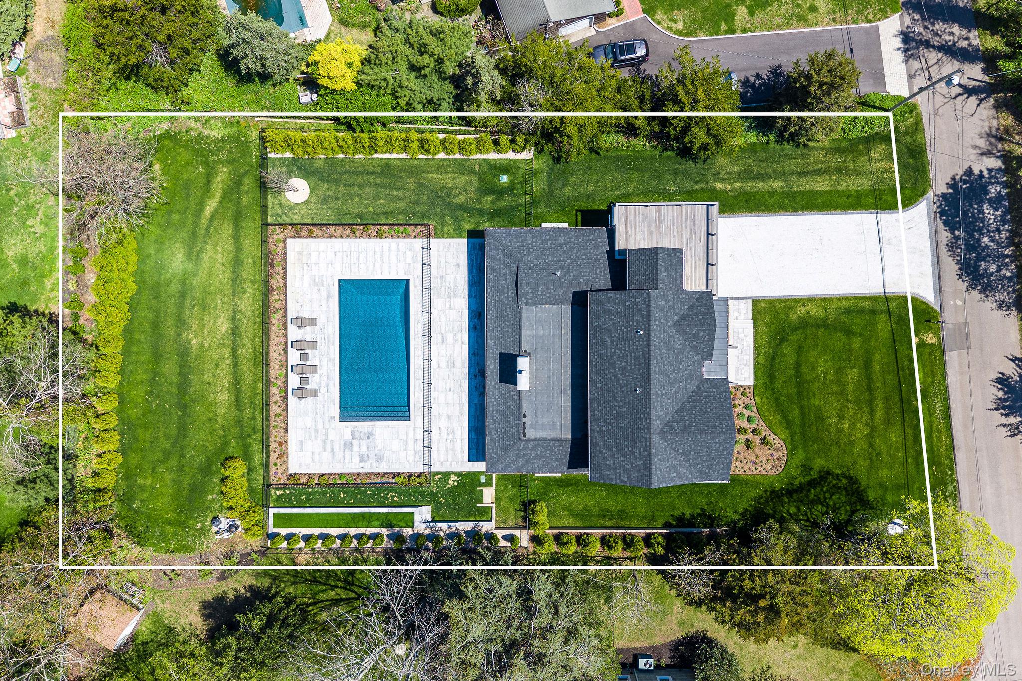 1665 Glenn Road Southold, NY 11971 - Photo 46 of 46 an aerial view of a house with a garden and yard
