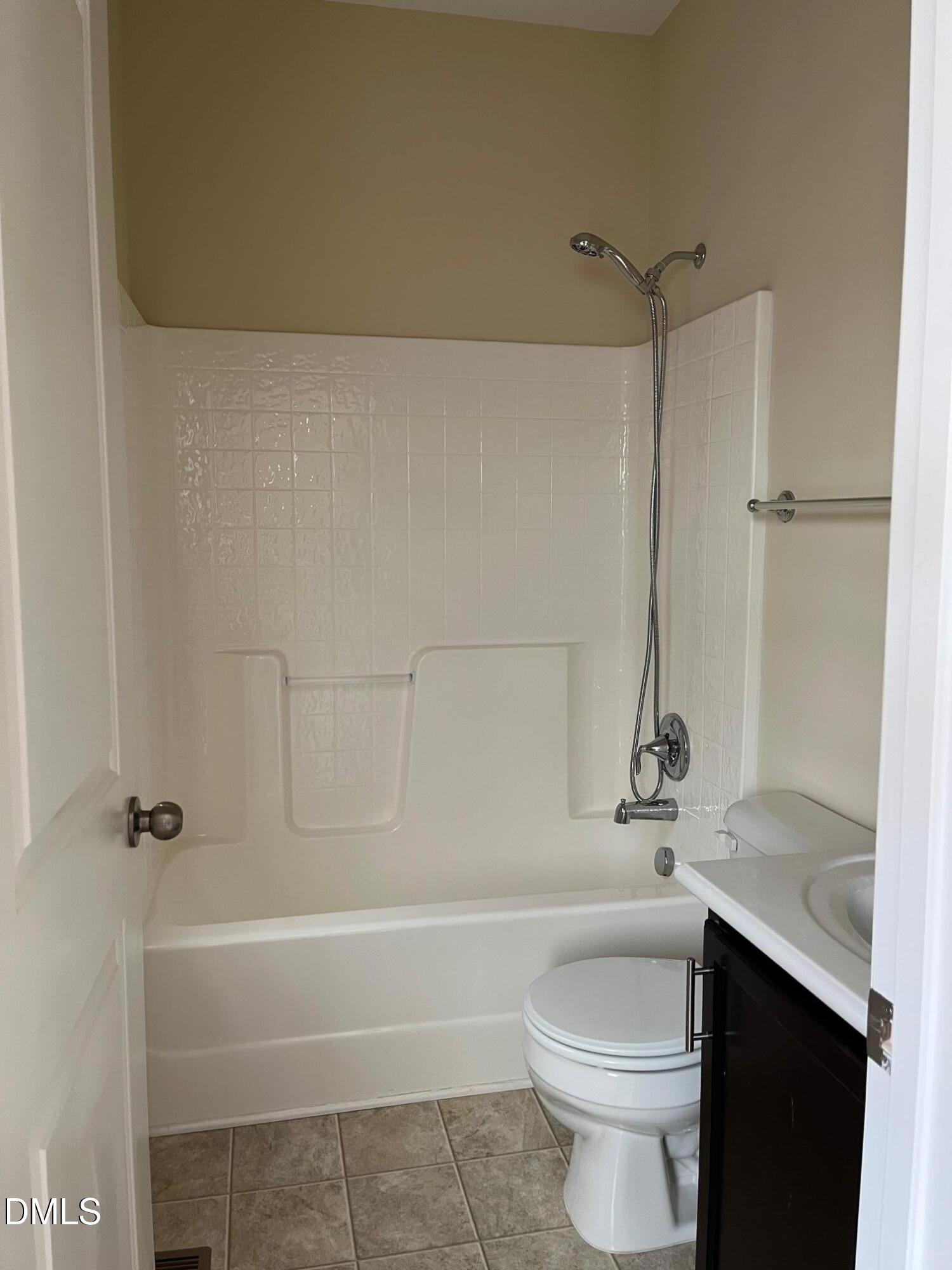 1517 Crafton Way Raleigh, NC 27607 - Photo 19 of 28 a bathroom with a sink a toilet and shower
