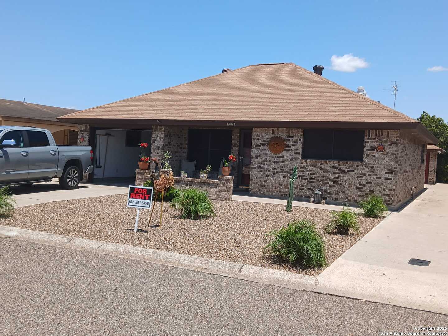 1816 Polk Street Mission, TX 78572 - Photo 1 of 21 a front view of a house with a yard and garage