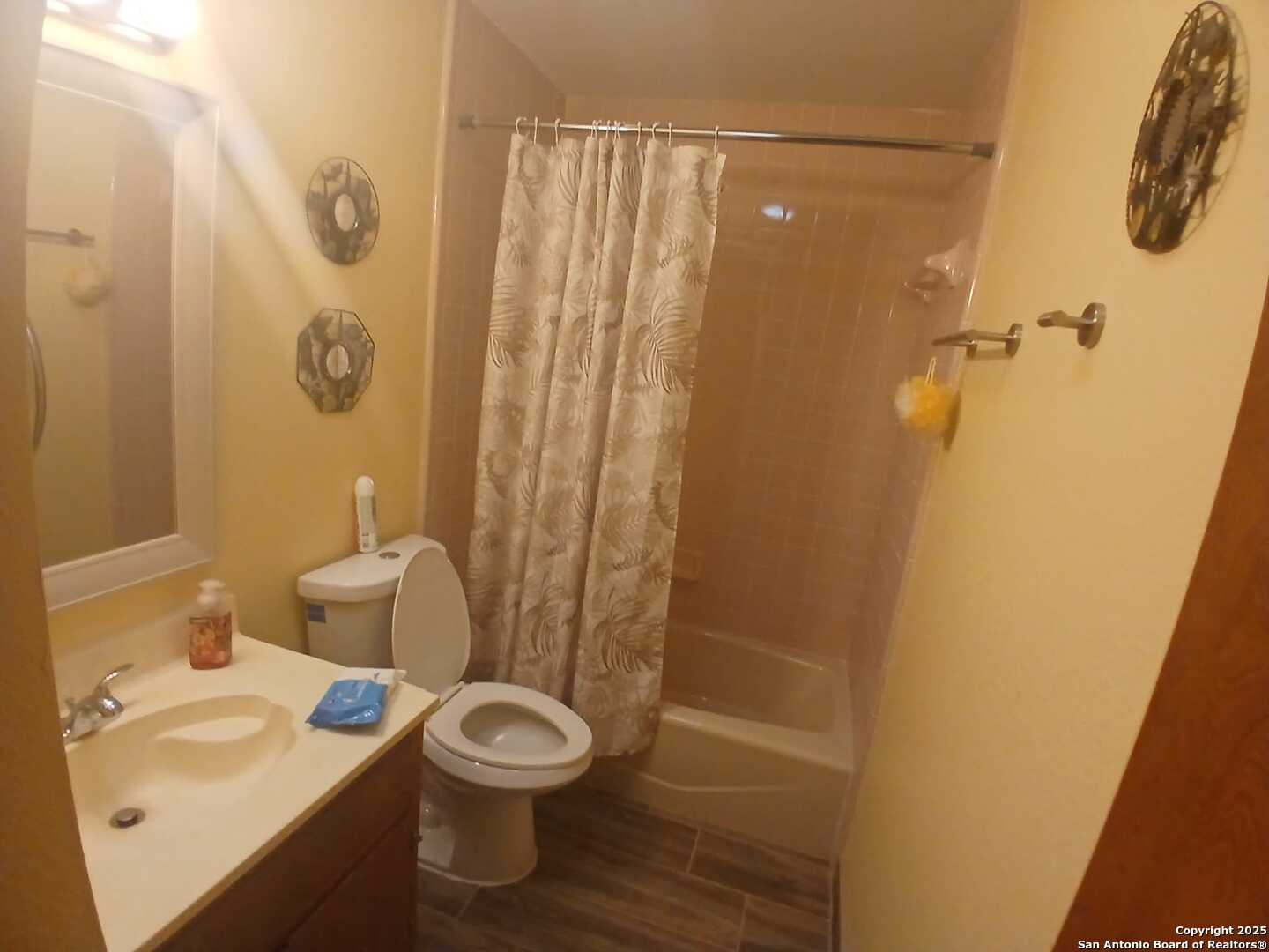 1816 Polk Street Mission, TX 78572 - Photo 11 of 21 a bathroom with a sink a toilet a shower and a mirror