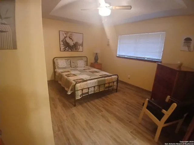 a bedroom with a bed and a desk