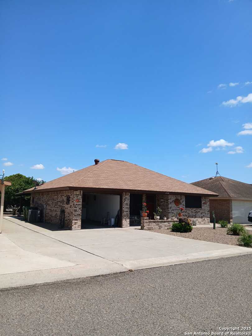1816 Polk Street Mission, TX 78572 - Photo 2 of 21 a front view of a house with a yard