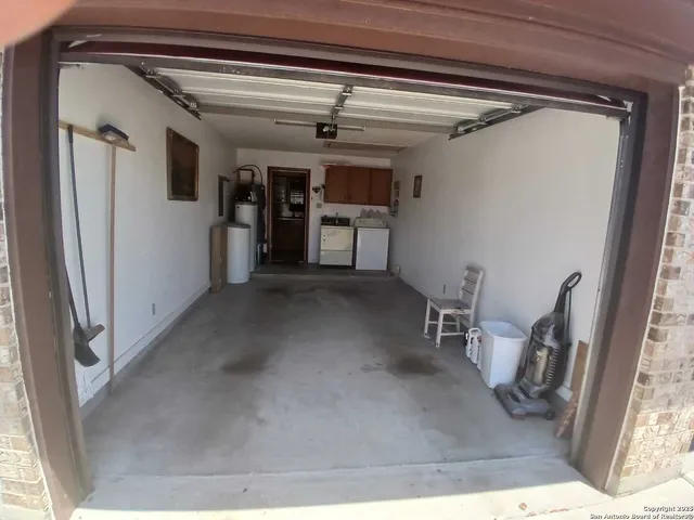 a view of a hallway with closet and cabinet