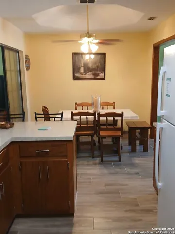 a kitchen with a sink cabinets and window