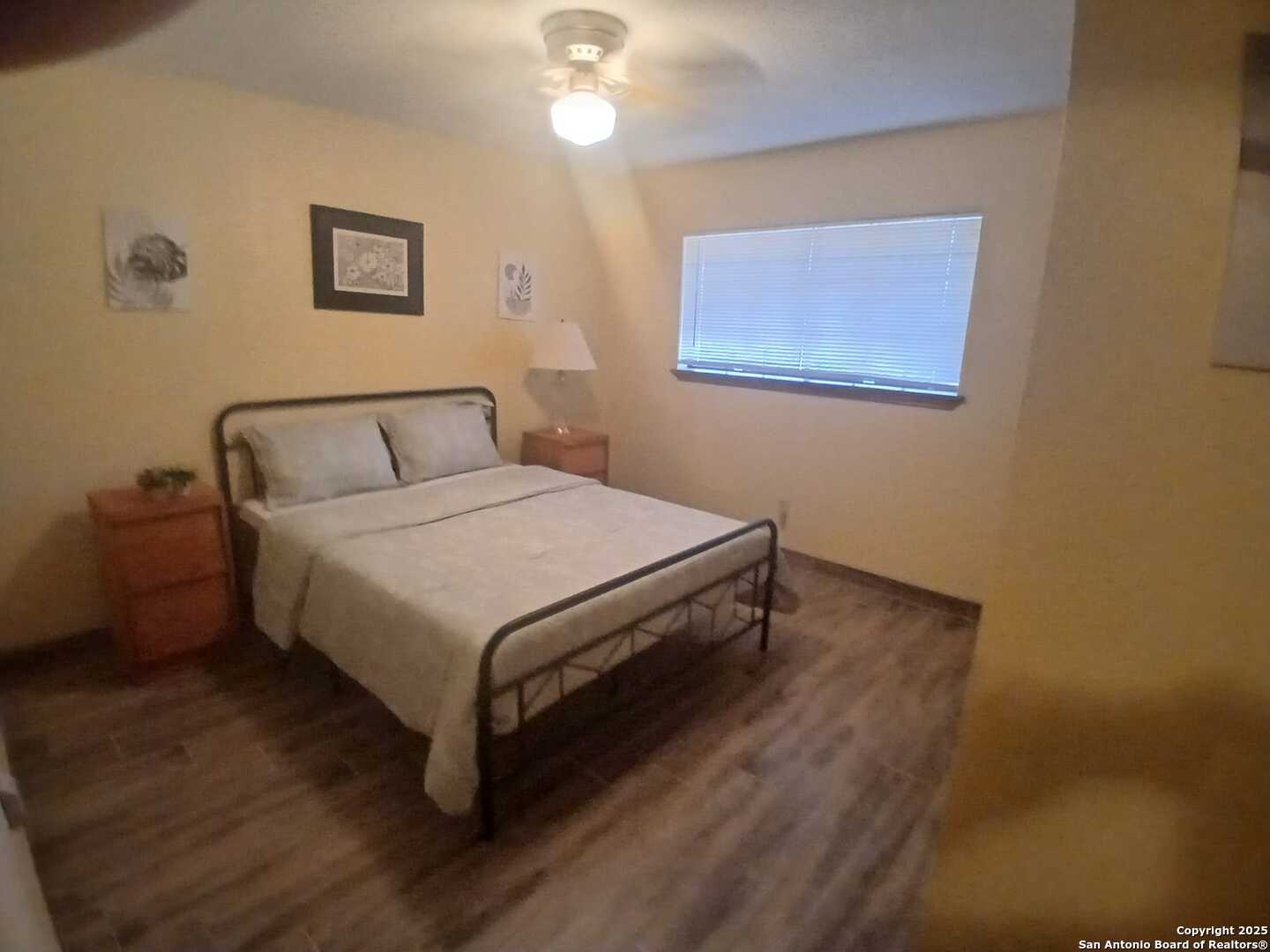 1816 Polk Street Mission, TX 78572 - Photo 10 of 21 a bedroom with a bed and a night stand