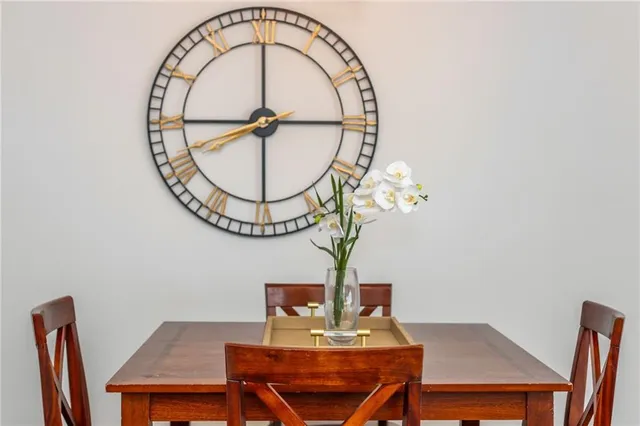 a view of a room with a table and chairs