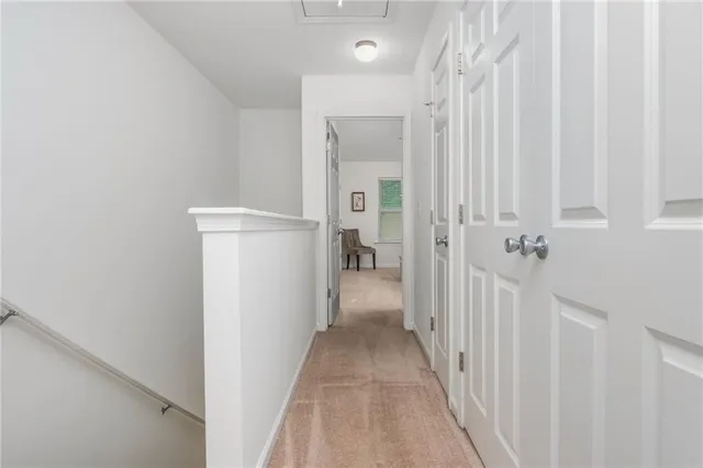 a view of a hallway with a white walls