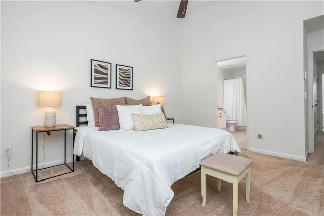 a bedroom with a bed and a table