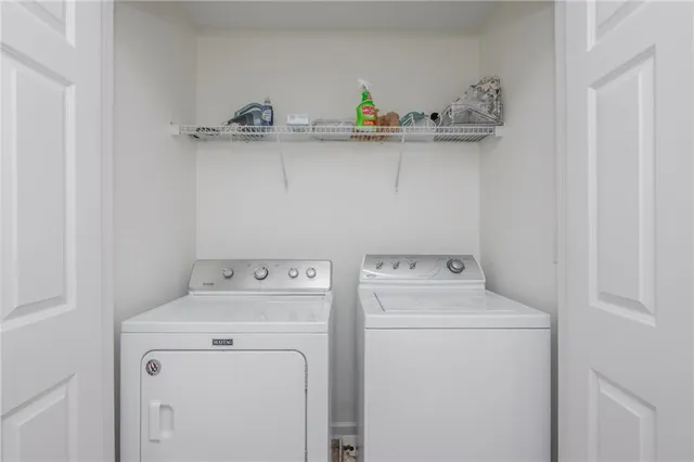 a utility room with dryer and washer