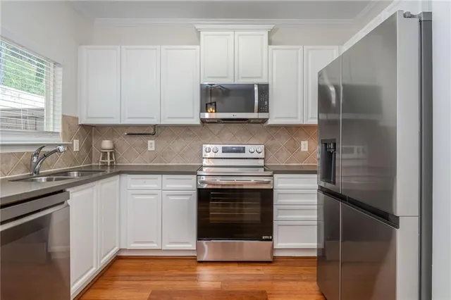 a kitchen with a sink and a microwave