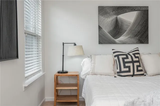 a bedroom with a bed and a dresser