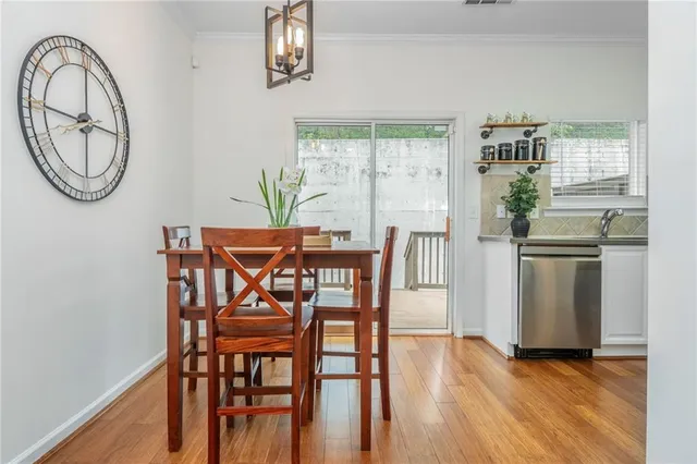 a view of a dining room with furniture window and wooden floor