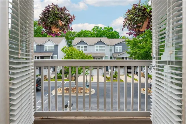 a view of a balcony and yard