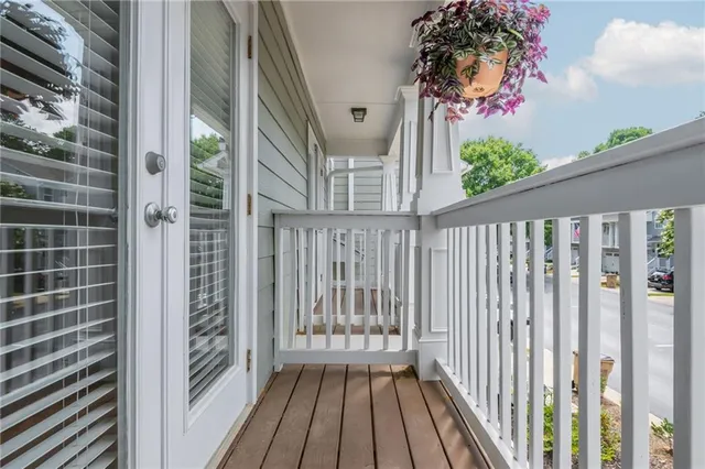 a view of a balcony with wooden floor