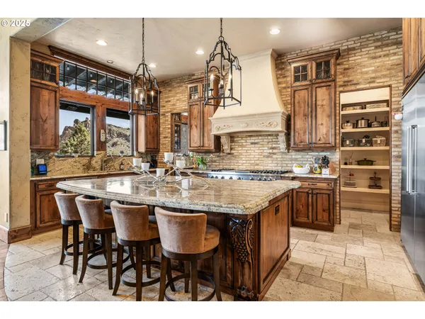 a kitchen with a counter space appliances and cabinets