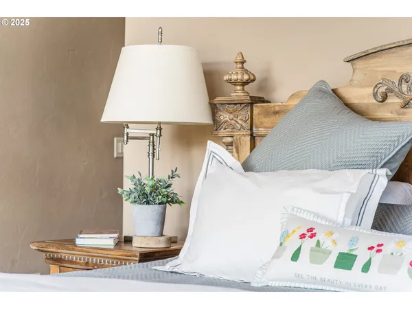 a bedroom with a large bed and a large window