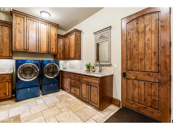 a bathroom with a sink a bathtub and a vanity