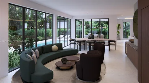 a living room with furniture and a floor to ceiling window