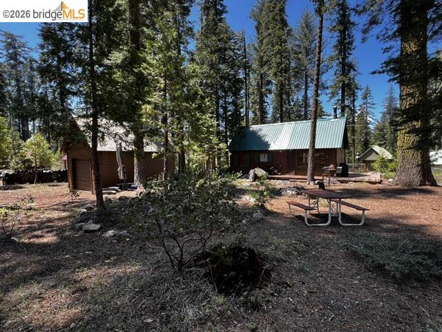 39 Cow Creek Road Pinecrest, CA 95364 - Photo 12 of 44 a view of a fire pit in backyard of the house