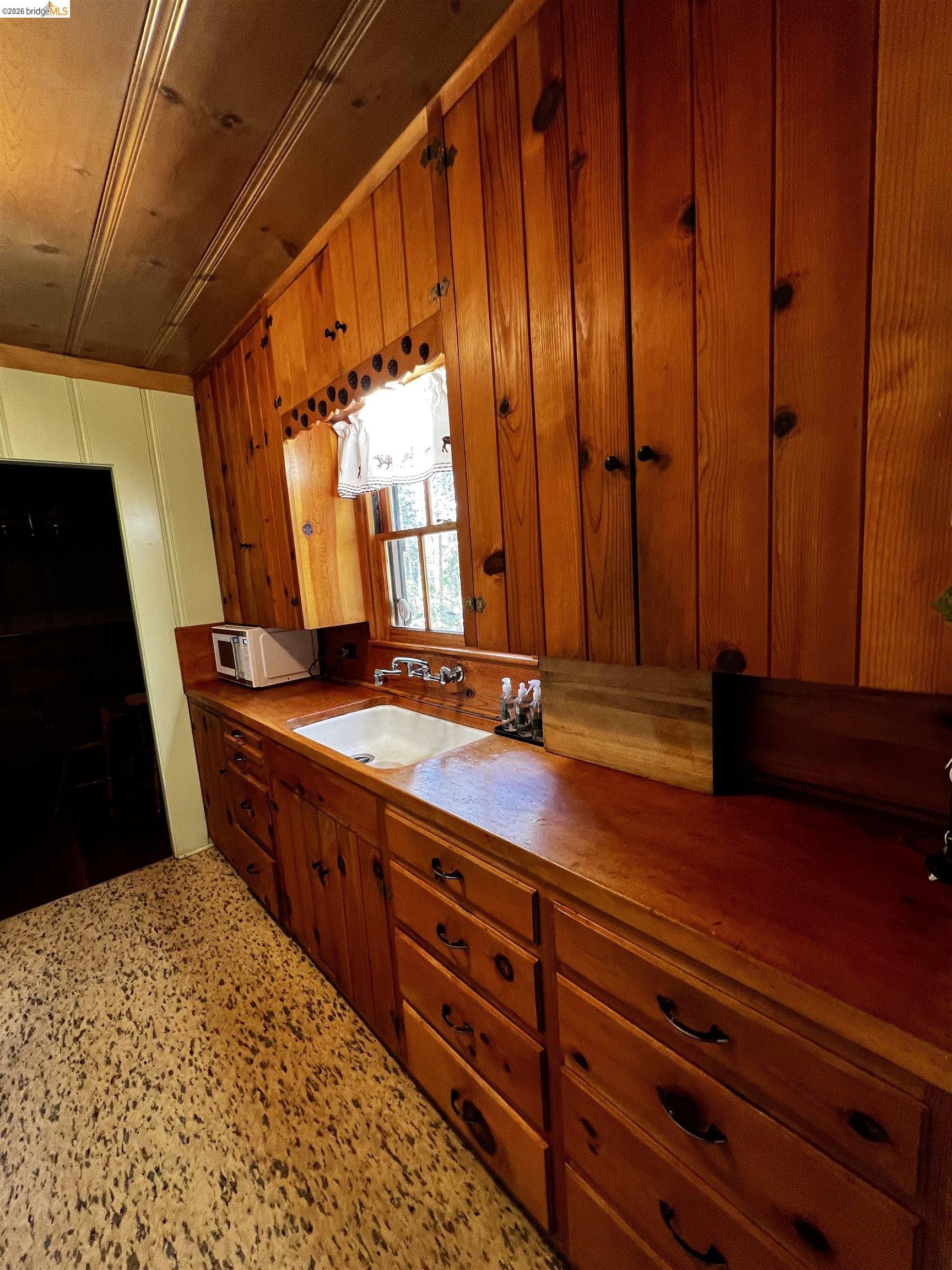 39 Cow Creek Road Pinecrest, CA 95364 - Photo 15 of 44 a bathroom with a sink and a mirror