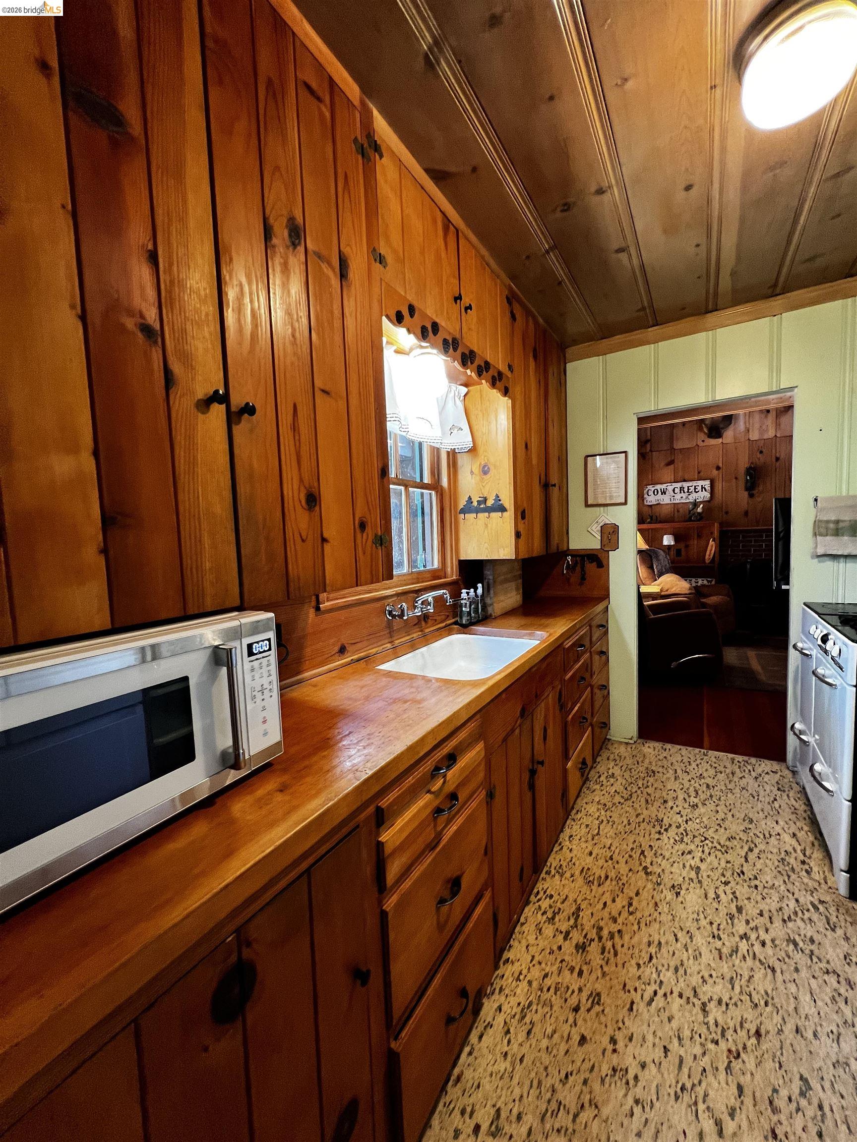 39 Cow Creek Road Pinecrest, CA 95364 - Photo 16 of 44 a large kitchen with a large window