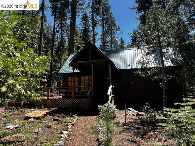 39 Cow Creek Road Pinecrest, CA 95364 - Photo 2 of 44 a front view of a house with a yard