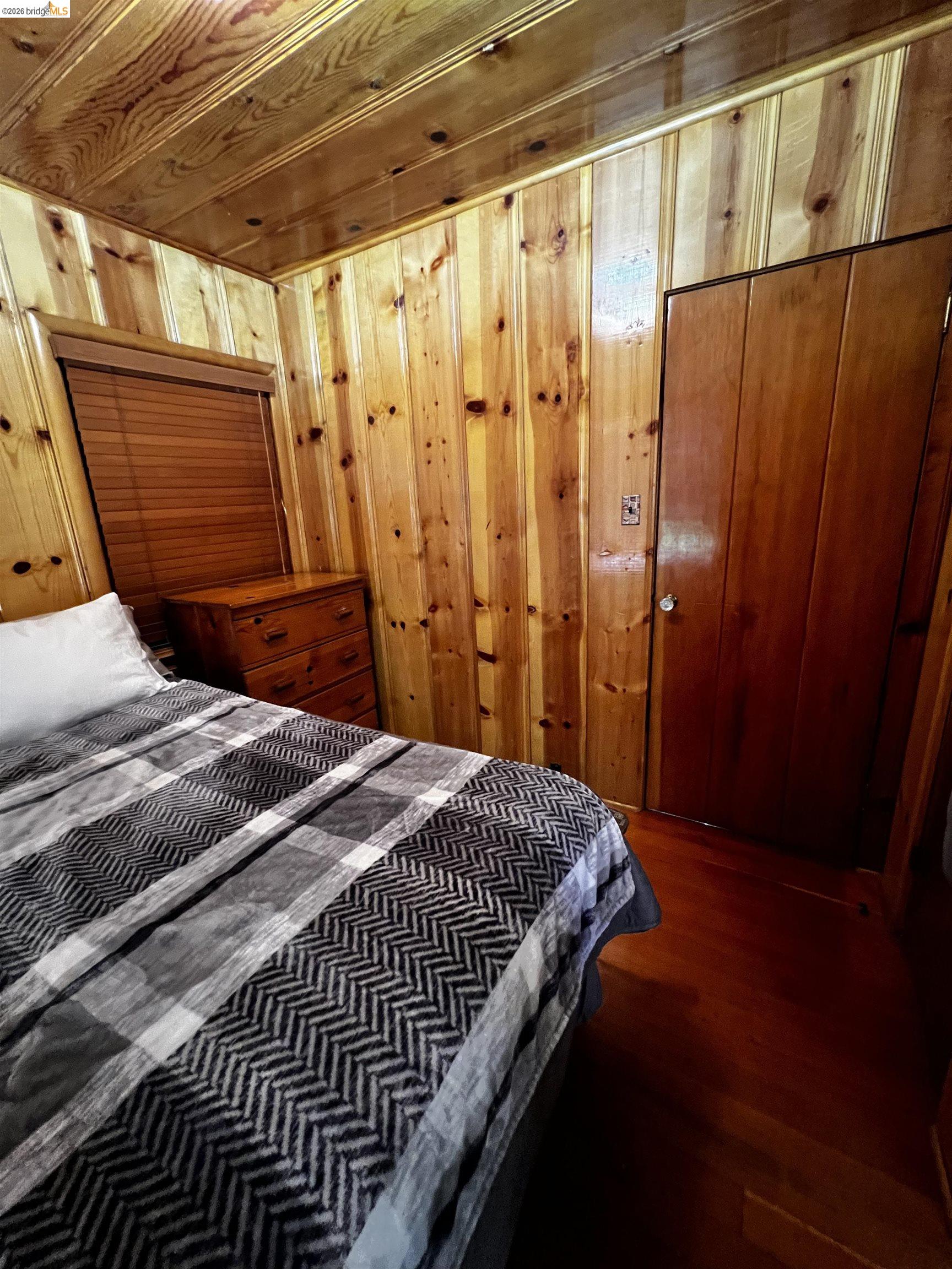 39 Cow Creek Road Pinecrest, CA 95364 - Photo 33 of 44 a bedroom with a bed and a shower