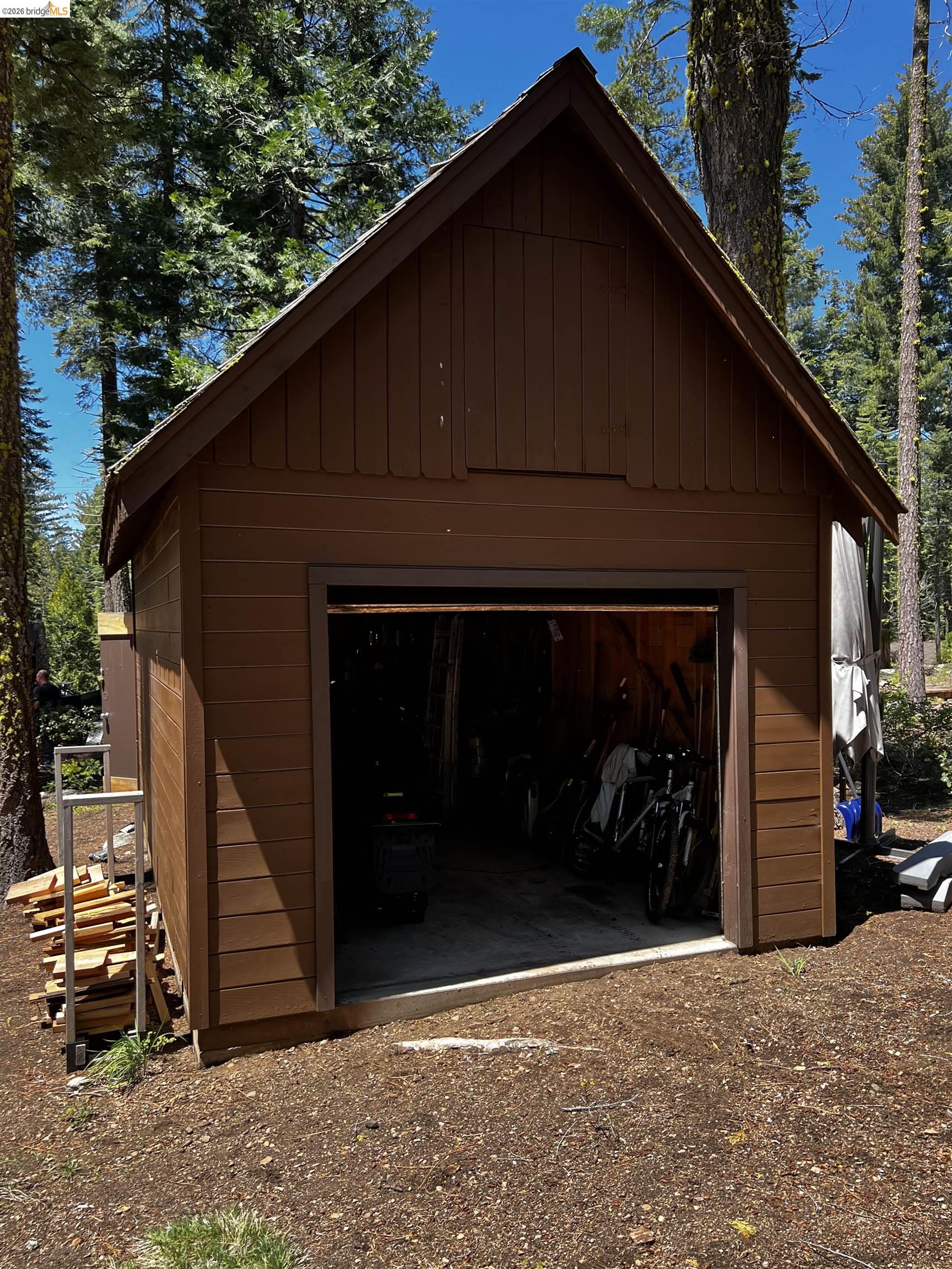 39 Cow Creek Road Pinecrest, CA 95364 - Photo 39 of 44 a front view of a house with a garden
