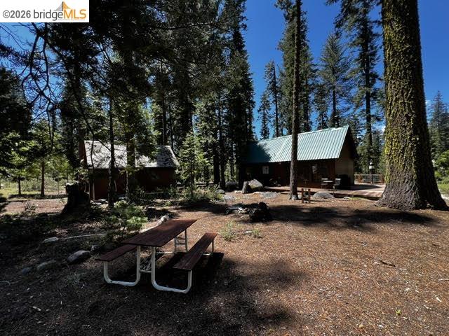 39 Cow Creek Road Pinecrest, CA 95364 - Photo 6 of 44 a view of a backyard with sitting area