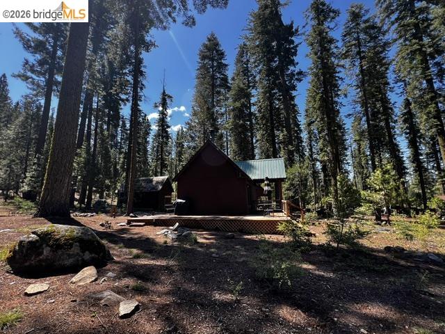 39 Cow Creek Road Pinecrest, CA 95364 - Photo 10 of 44 a backyard of a house with lots of green space