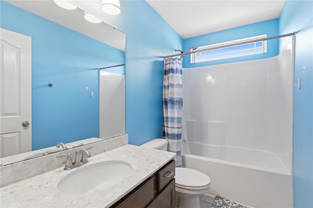 347 Riverdale Road Simpsonville, SC 29680 - Photo 15 of 30 This bright bathroom features a spacious tub and shower, with a window for natural light.