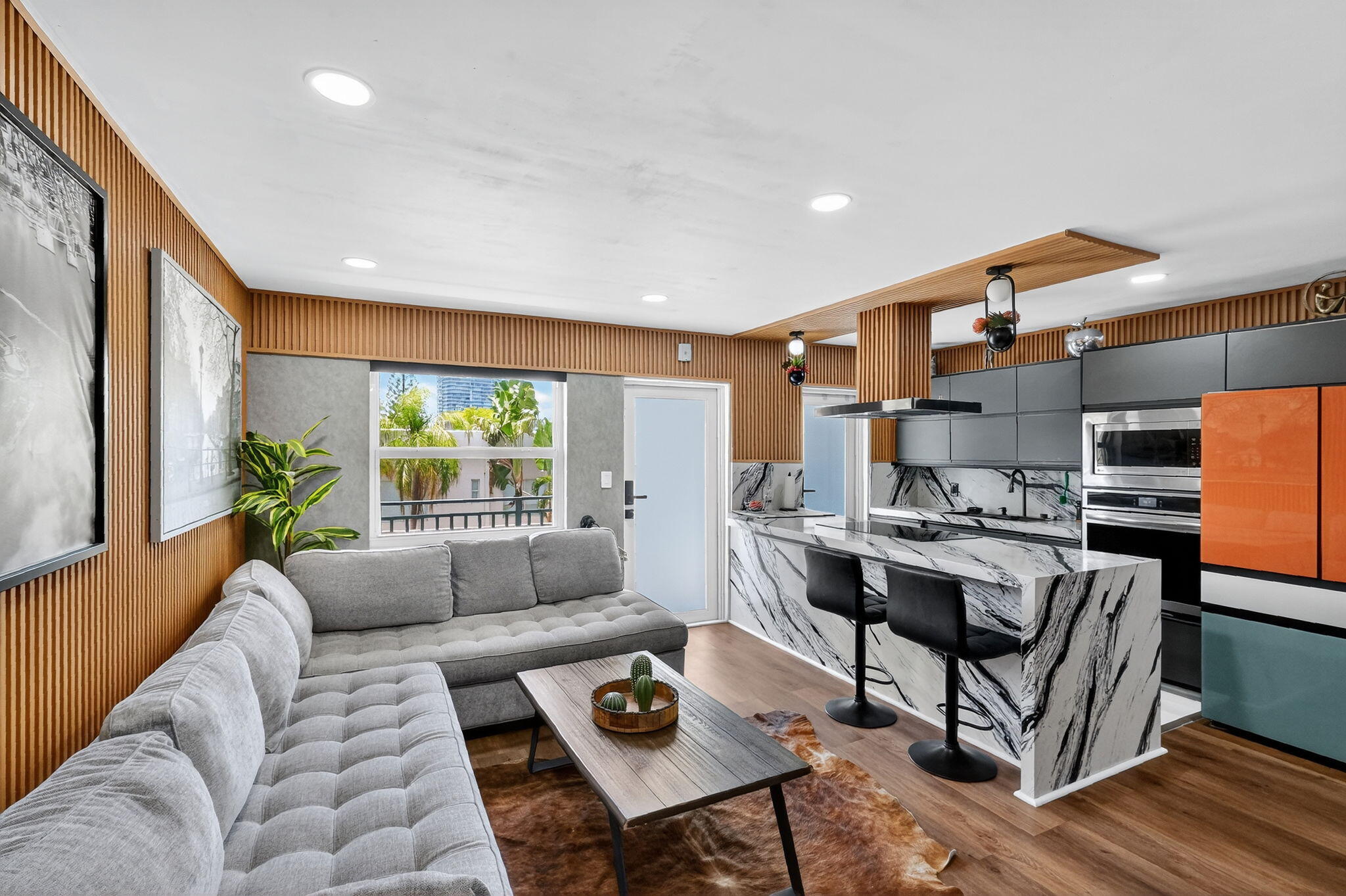 363 Washington Avenue, Unit 32 Miami Beach, FL 33139 - Photo 1 of 32 a living room with furniture and a table