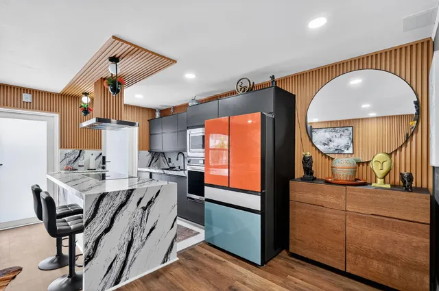 a view of a kitchen and dining room