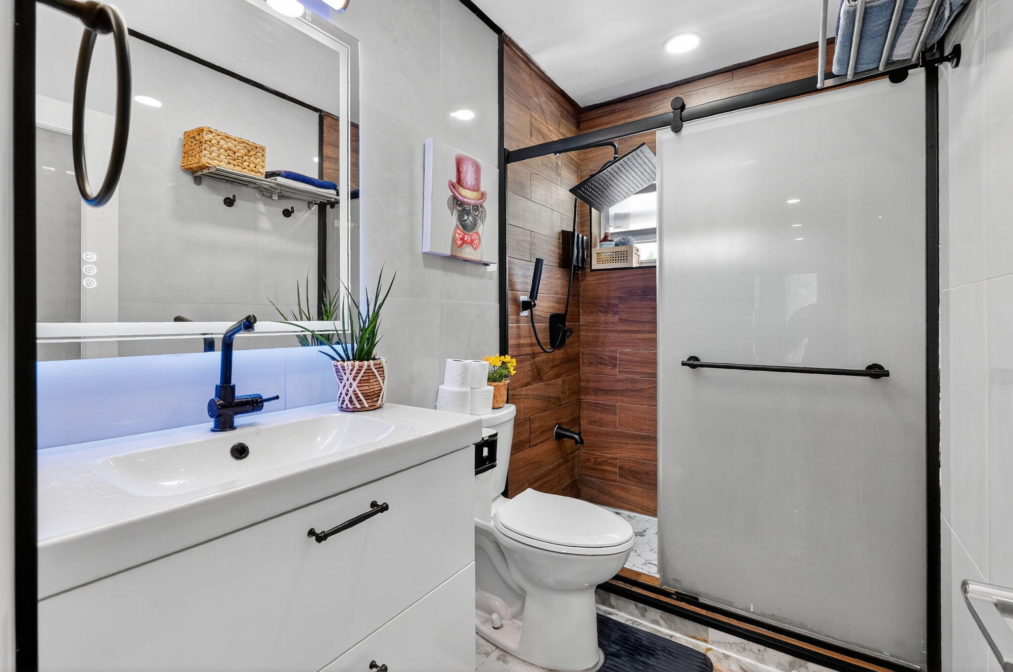 363 Washington Avenue, Unit 32 Miami Beach, FL 33139 - Photo 17 of 32 a bathroom with a sink and mirror