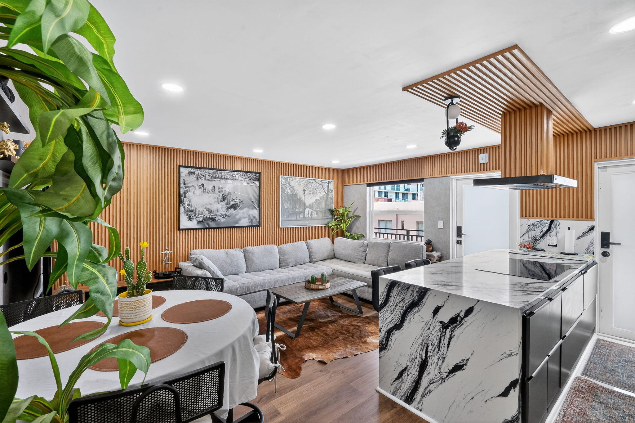 363 Washington Avenue, Unit 32 Miami Beach, FL 33139 - Photo 2 of 32 a living room with furniture and a potted plant