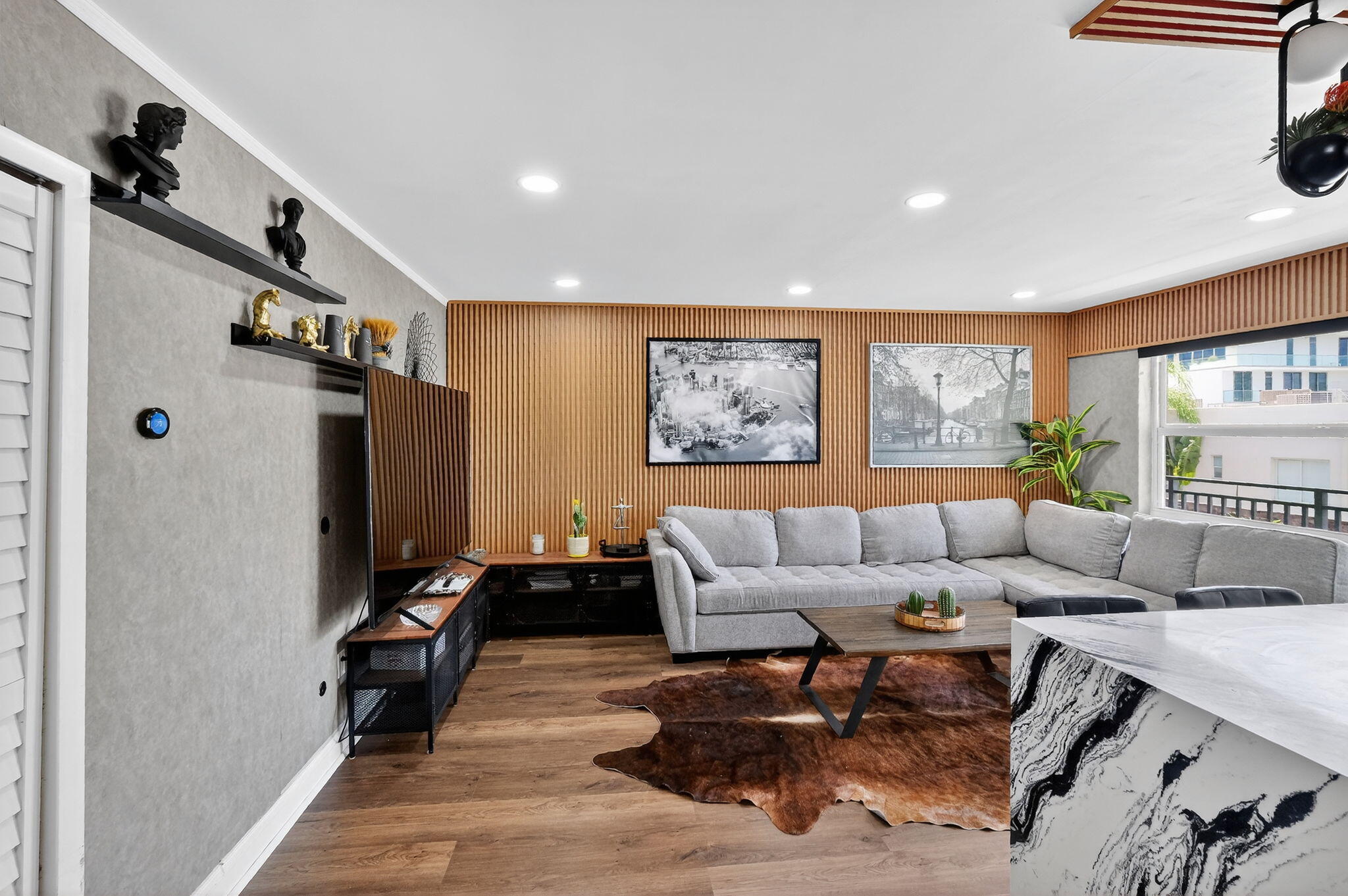363 Washington Avenue, Unit 32 Miami Beach, FL 33139 - Photo 5 of 32 a living room with furniture and a flat screen tv