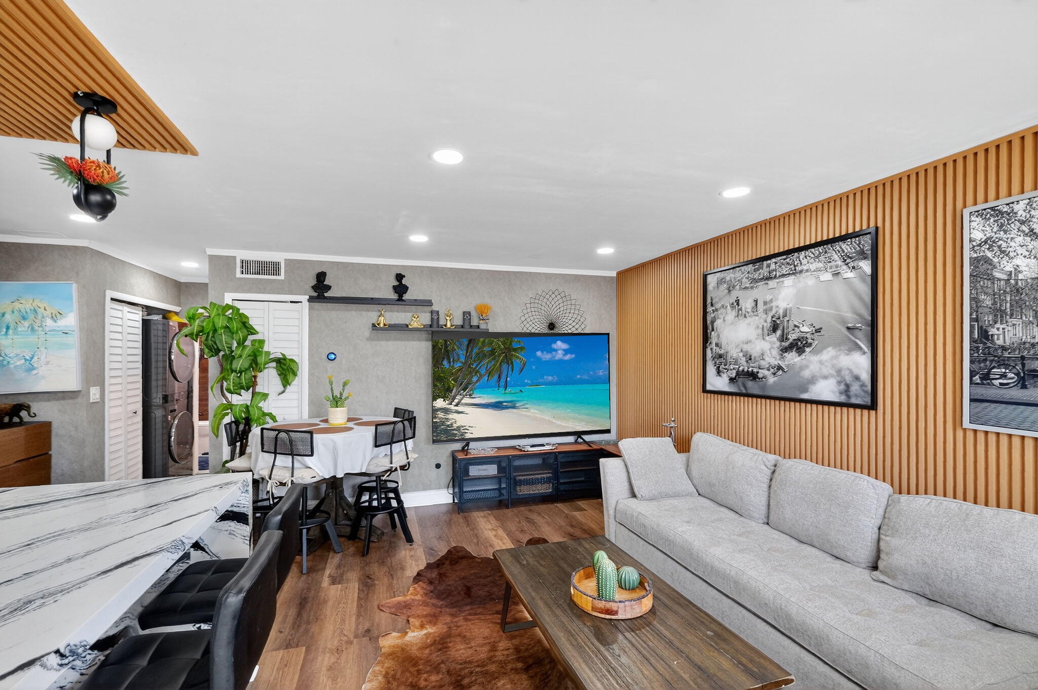 363 Washington Avenue, Unit 32 Miami Beach, FL 33139 - Photo 6 of 32 a living room with furniture and a flat screen tv