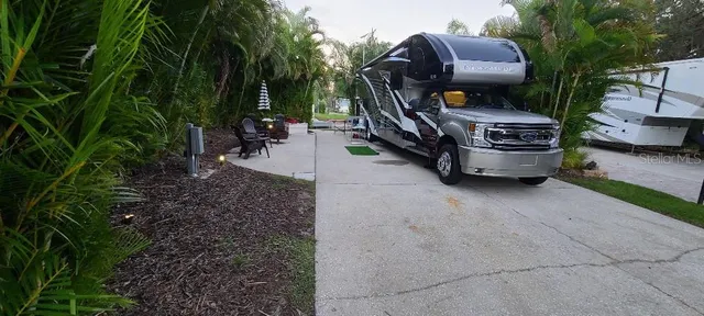 a view of outdoor space with garden and barbeque oven