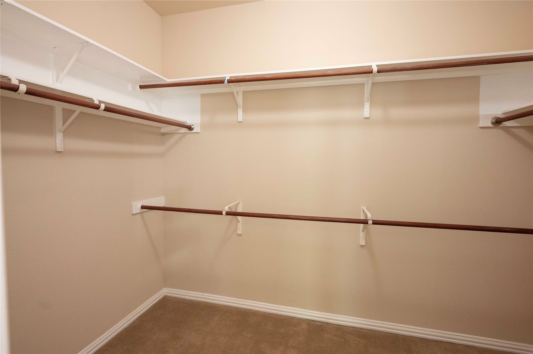2070 Intrepid Drive Buda, TX 78610 - Photo 11 of 31 A well-organized closet offers ample storage with sturdy rods and shelving.