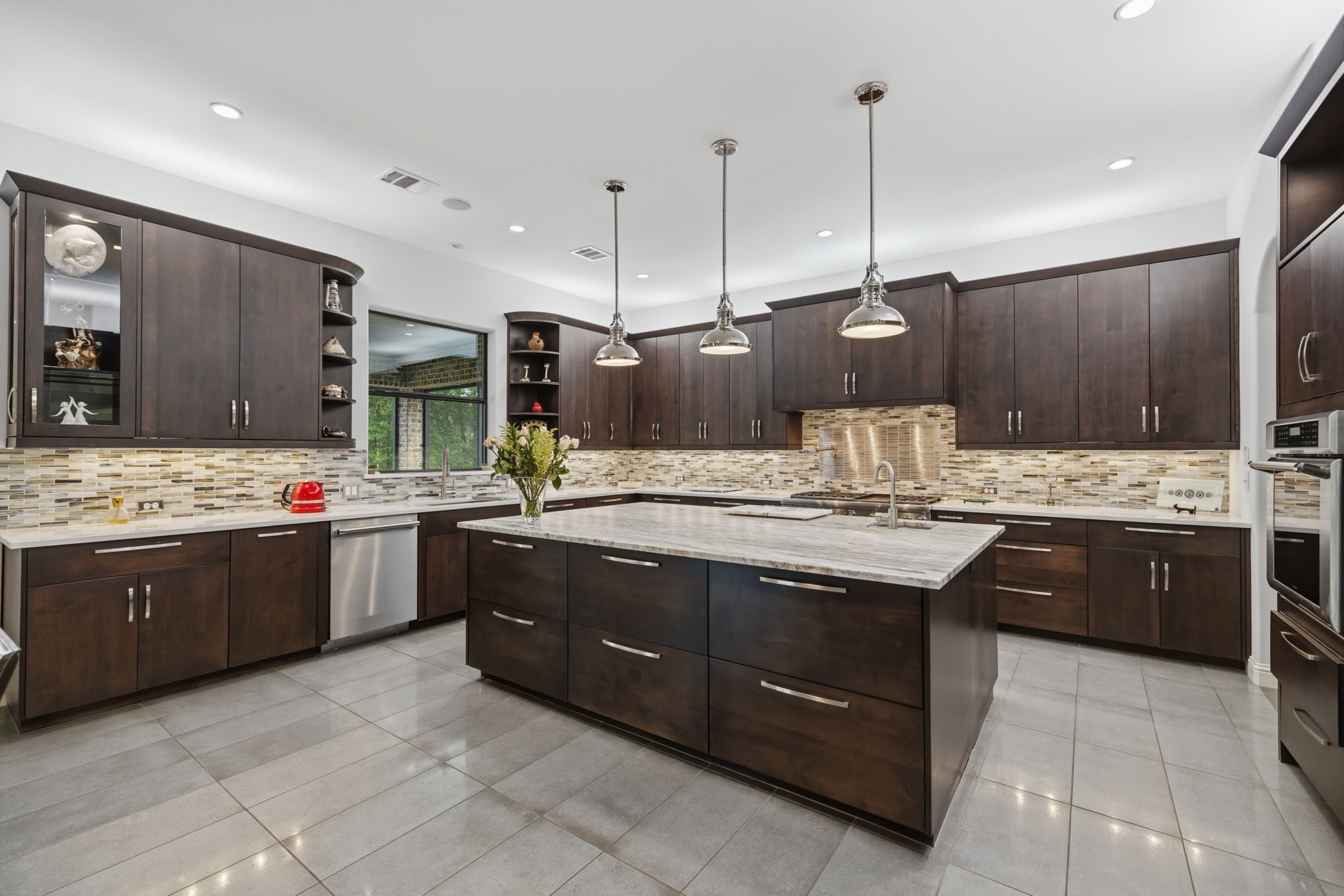 6918 Comanche Bend Montgomery, TX 77316 - Photo 23 of 50 Seamless flow from the kitchen to your outdoor kitchen and expansive outdoor living space creates the perfect setup for entertaining family and guests. Just around the corner to your right, the surprise is coming!