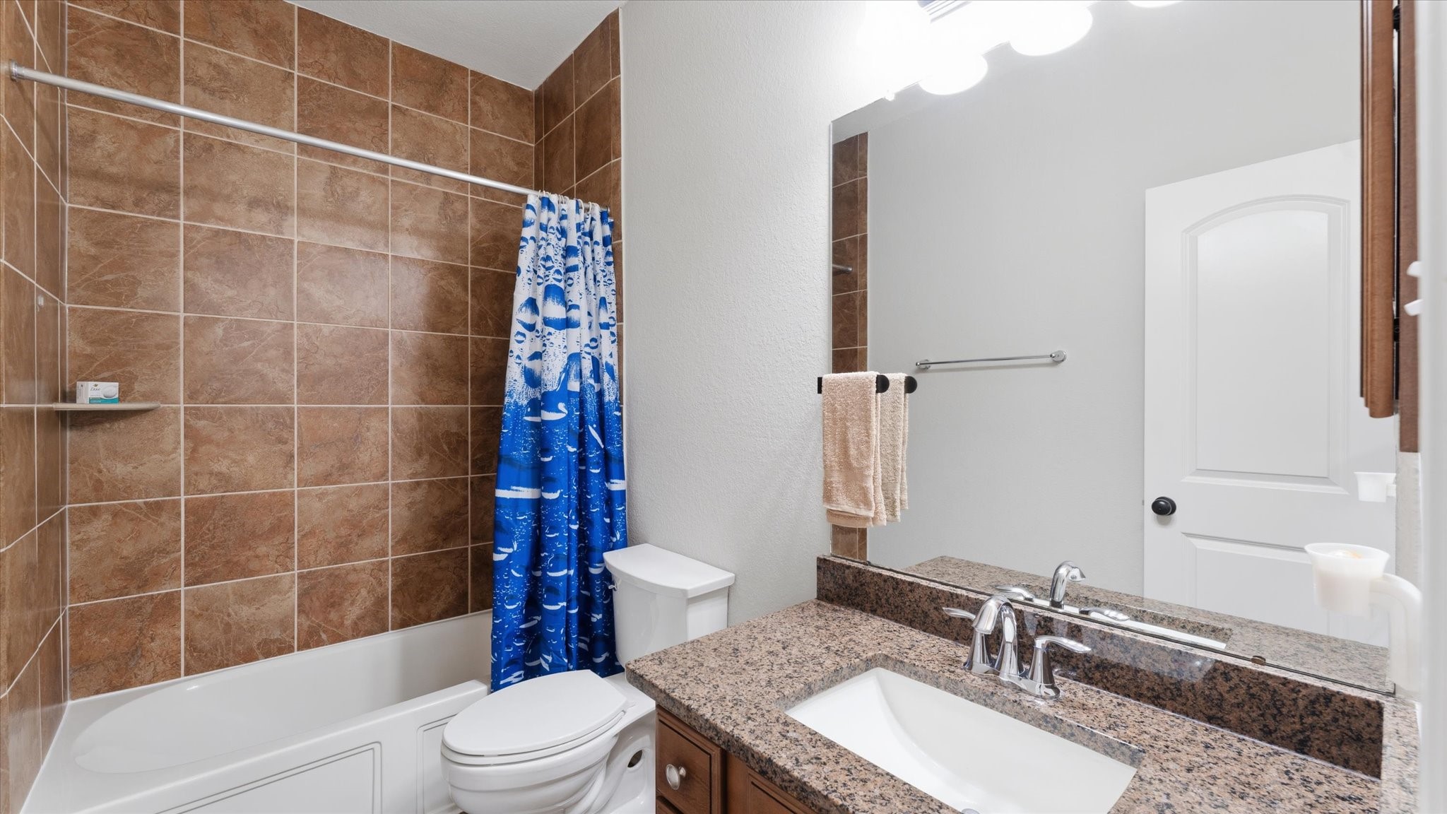 14 Painted Post Place Spring, TX 77389 - Photo 34 of 43 a bathroom with a sink a toilet and shower