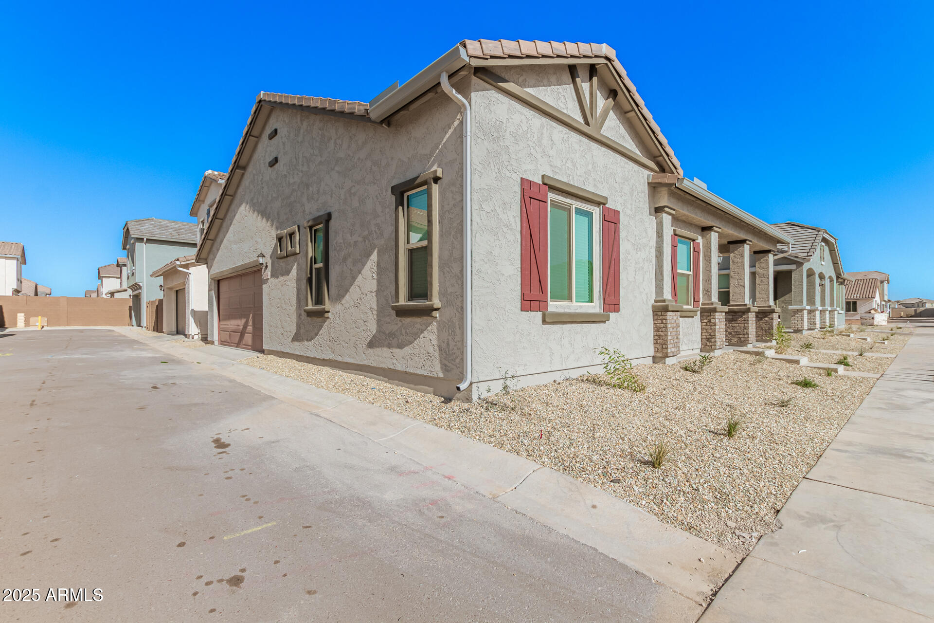 14134 West Hackamore Drive Surprise, AZ 85387 - Photo 3 of 17 Side landscape and garage
