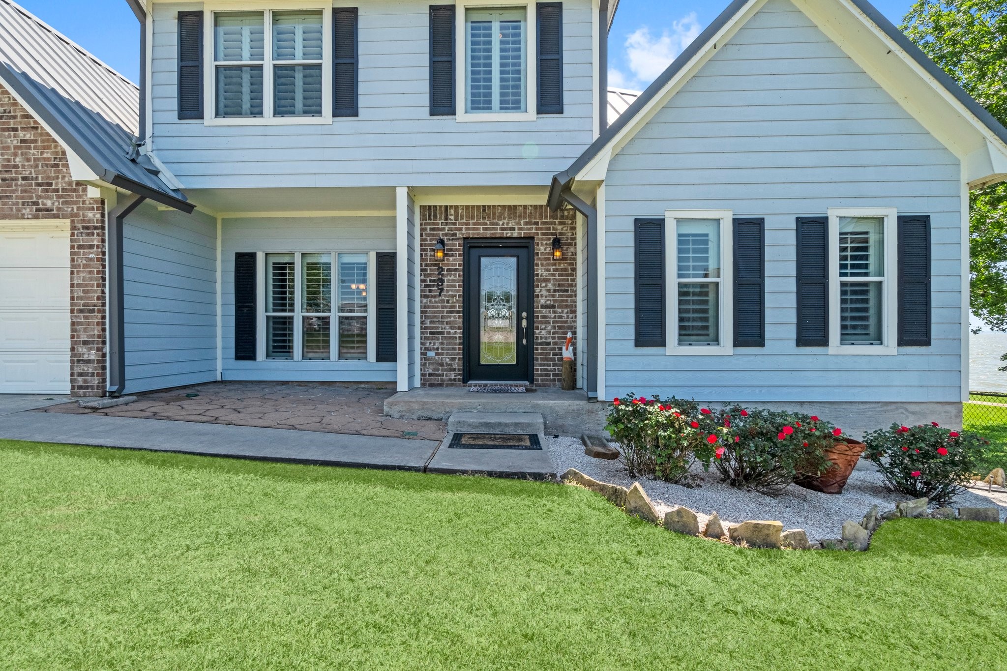 237 Vivian Road Onalaska, TX 77360 - Photo 4 of 49 So many amenities with this home! Wonderful views of the lake, porches for entertaining, boat house with outdoor kitchen, boat lift, sea doo lifts, slide and some of the best fishing right off the boathouse dock . Owner says a fishing "channel" draws many fishermen by this area.