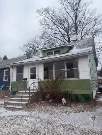 a view of a house with a yard and plants