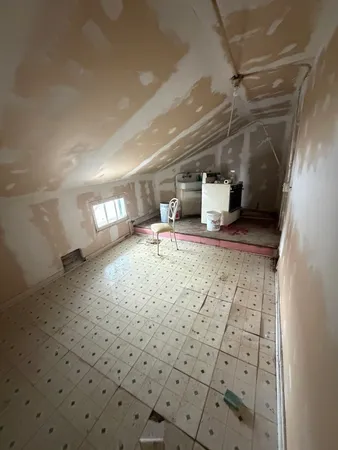 a view of a closet with wooden floor
