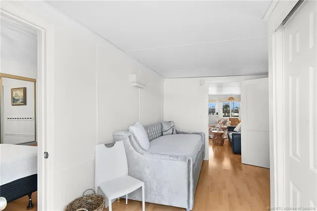 a bedroom with furniture and a window