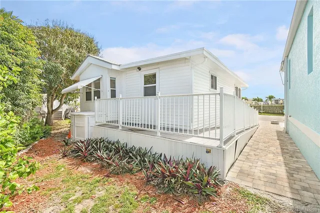a view of a balcony with an ocean view